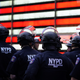 NYPD police officers watch demonstrators in Times Square on June 1, 2020, during a “Black Lives Matter” protest.